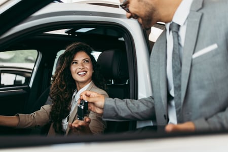 Stock- Woman purchasing car